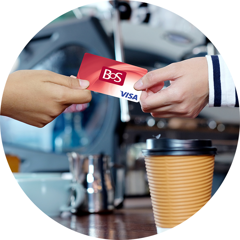 Someone using a Bank of Springfield debit card to pay for a cup of coffee.